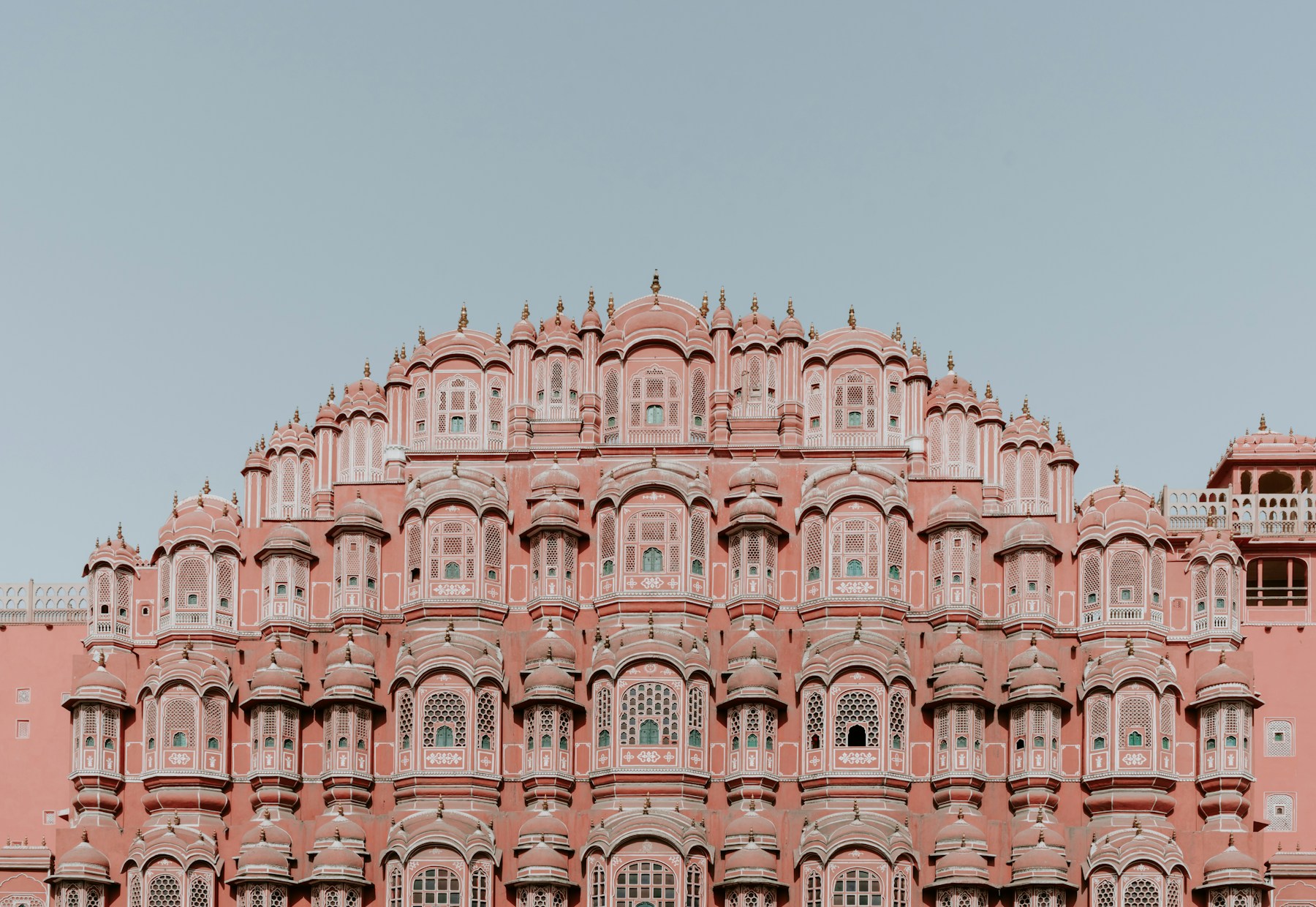 The intricate pink sandstone windows of Hawa Mahal, Jaipur